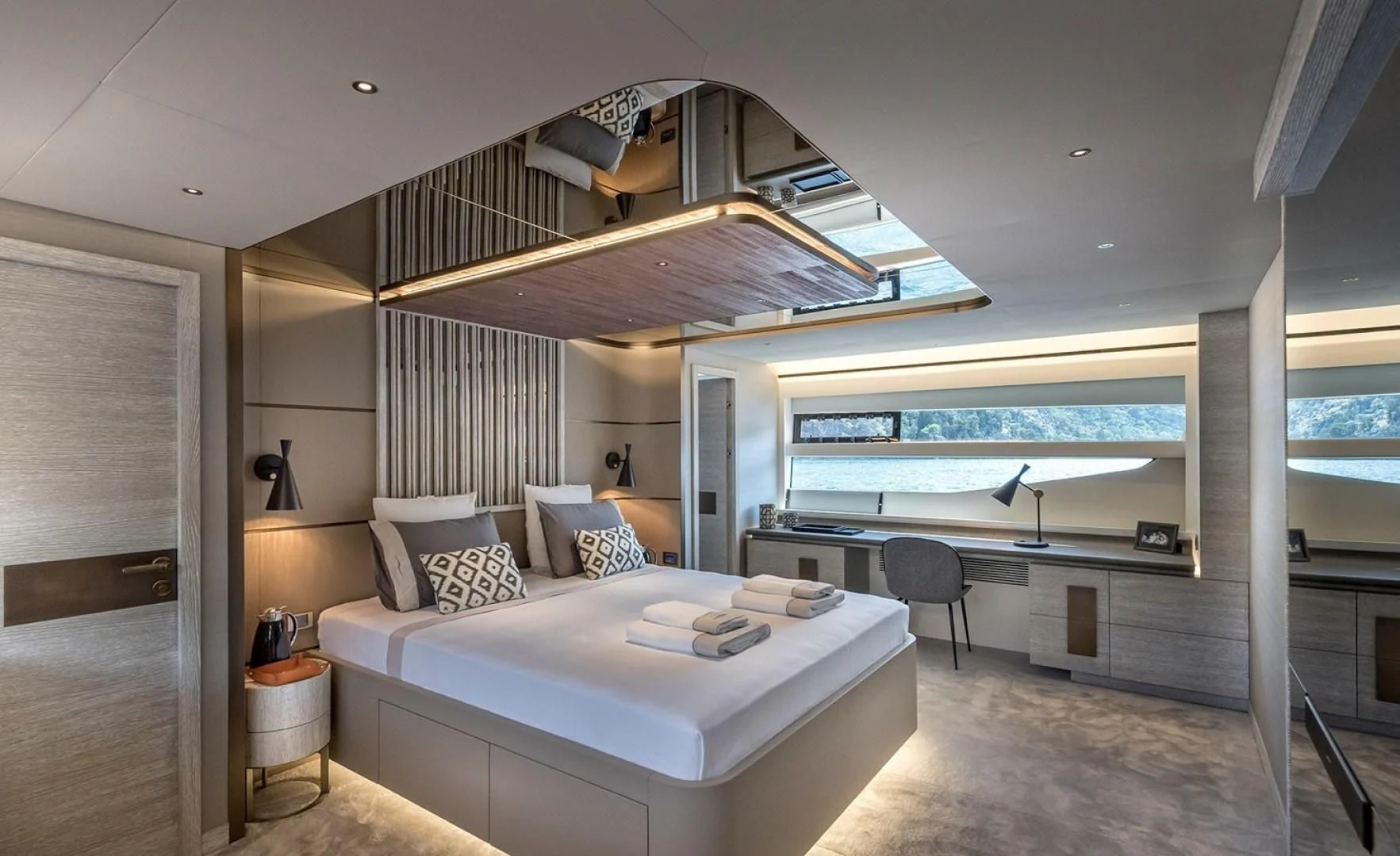 a large bedroom with a large balcony aboard NUMARINE 26XP/24 Yacht for Sale