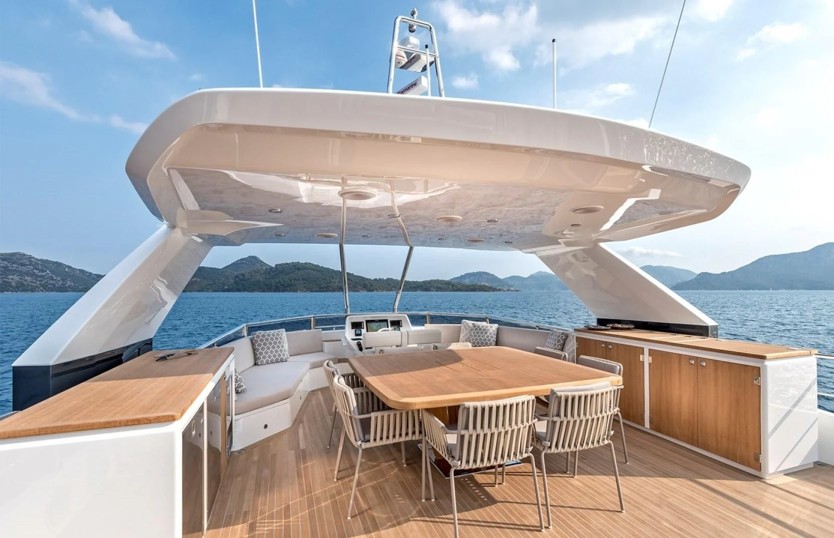 a large white ship with a deck and chairs on a deck aboard NUMARINE 26XP/24 Yacht for Sale