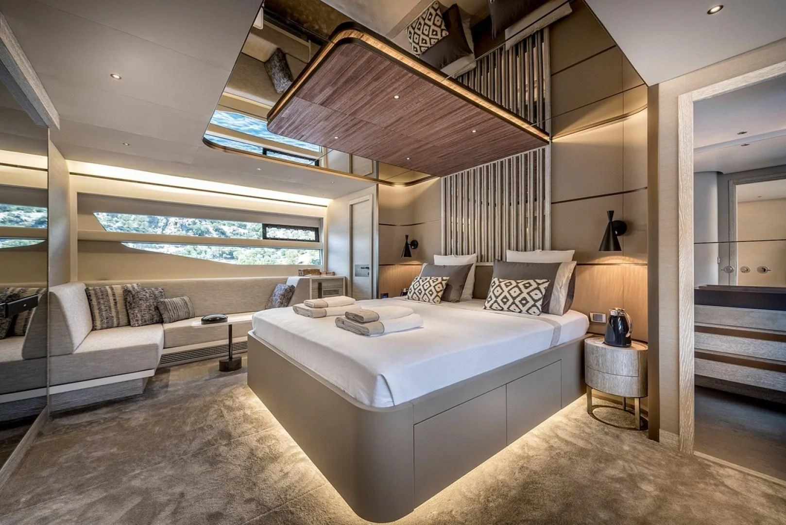 a room with a bed and a couch aboard NUMARINE 26XP/24 Yacht for Sale