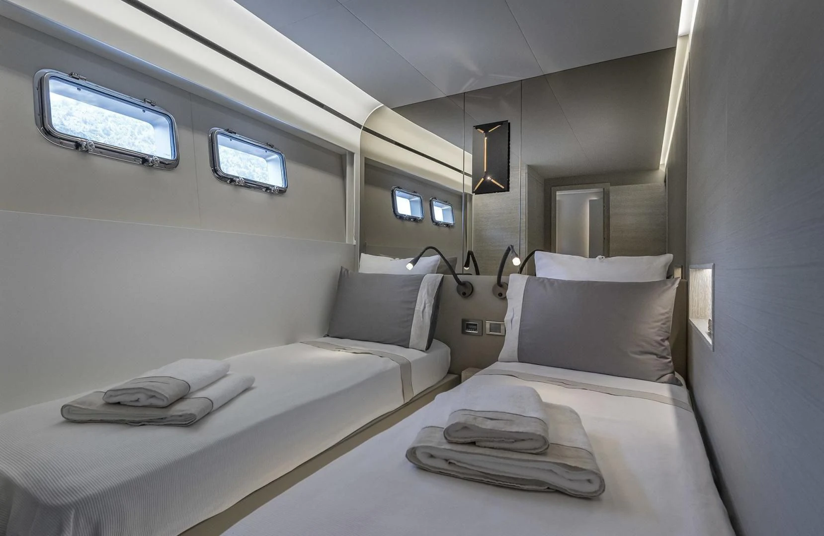 a room with beds and a window aboard NUMARINE 26XP/24 Yacht for Sale