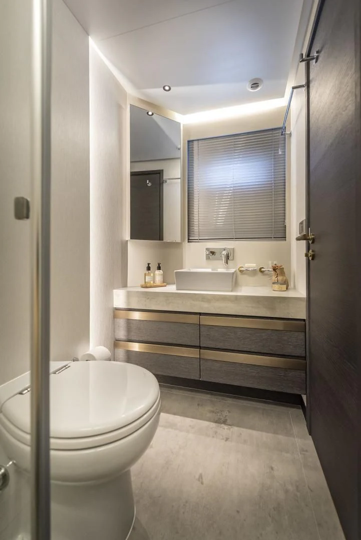 a bathroom with a sink and a toilet aboard NUMARINE 26XP/24 Yacht for Sale