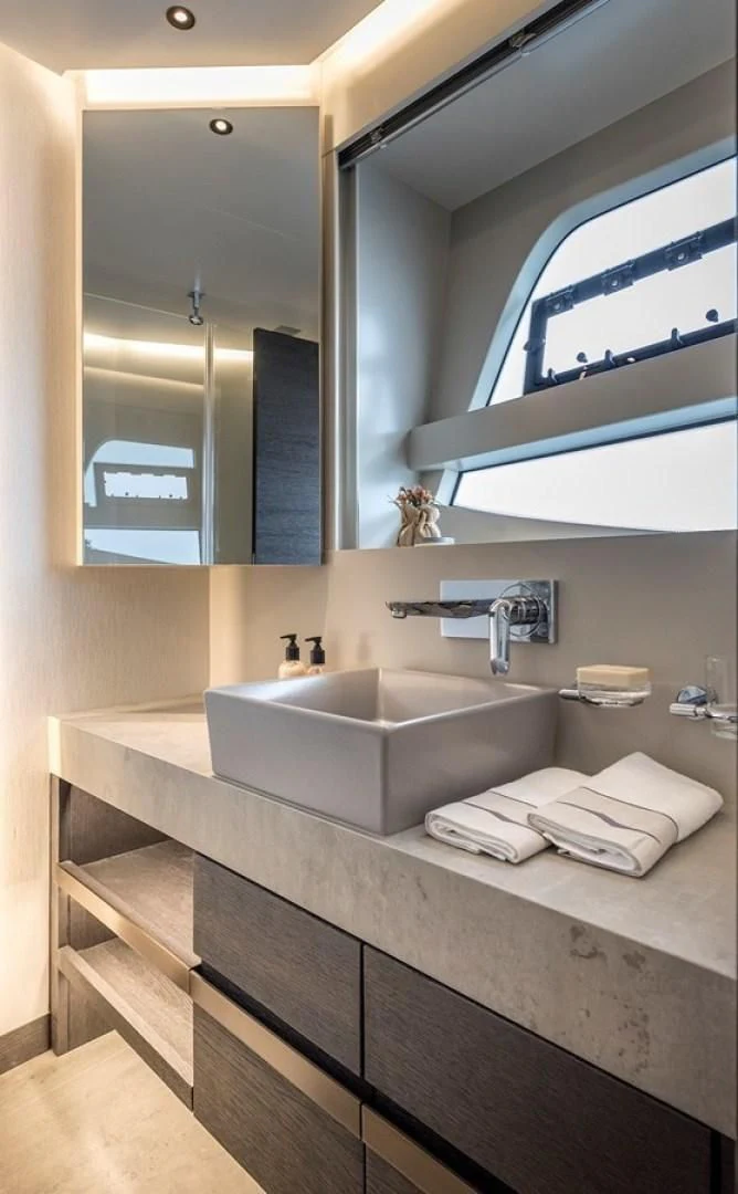a bathroom with a large mirror aboard NUMARINE 26XP/24 Yacht for Sale