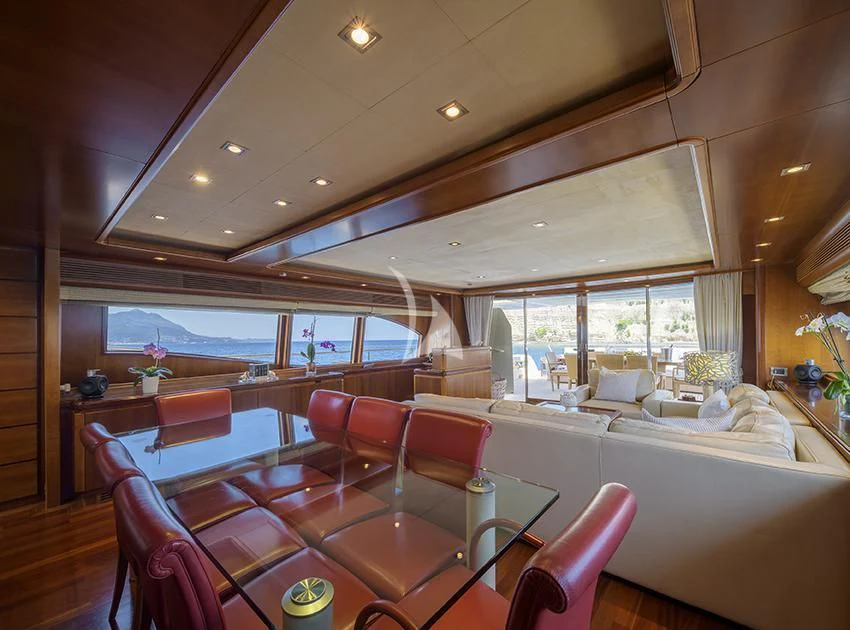 a room with a bed and a table aboard ANNE MARIE Yacht for Sale