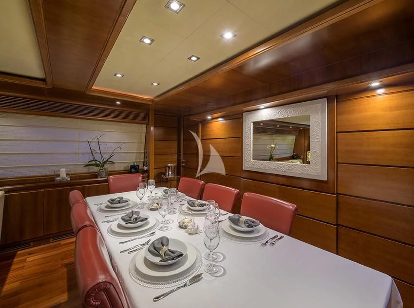 a dining room with a table set aboard ANNE MARIE Yacht for Sale