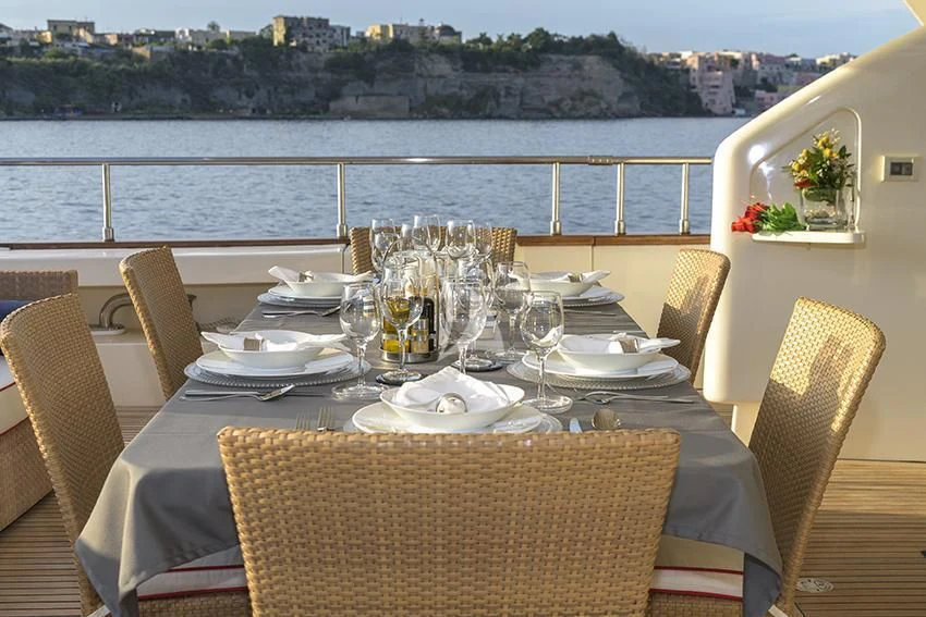 a table set with place settings aboard ANNE MARIE Yacht for Sale