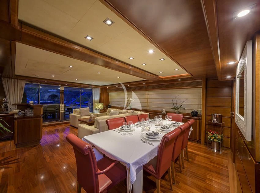 a large room with tables and chairs aboard ANNE MARIE Yacht for Sale