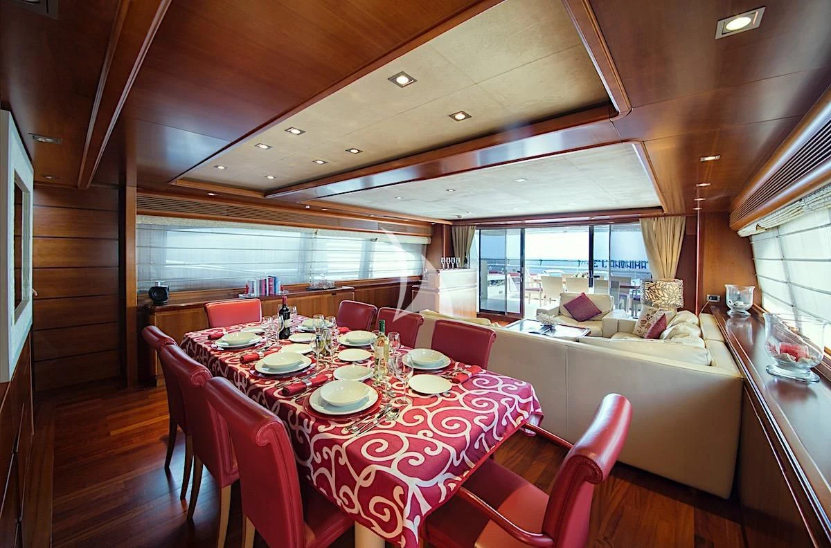 a dining room with a table and chairs aboard ANNE MARIE Yacht for Sale