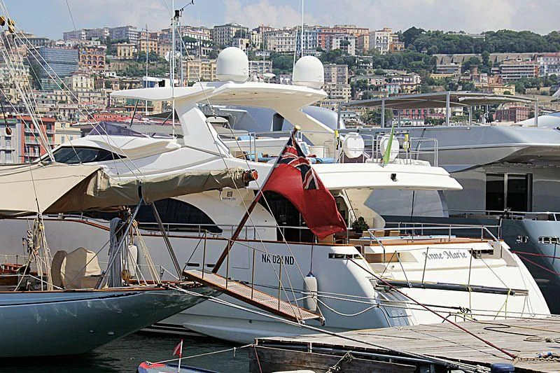 a group of boats are parked in a harbor aboard ANNE MARIE Yacht for Sale