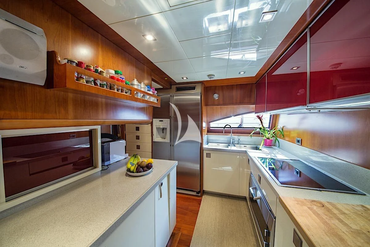 a kitchen with a large island aboard ANNE MARIE Yacht for Sale