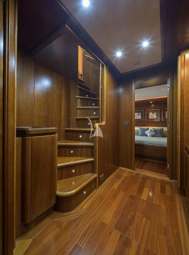 a bathroom with a wood cabinet aboard ANNE MARIE Yacht for Sale
