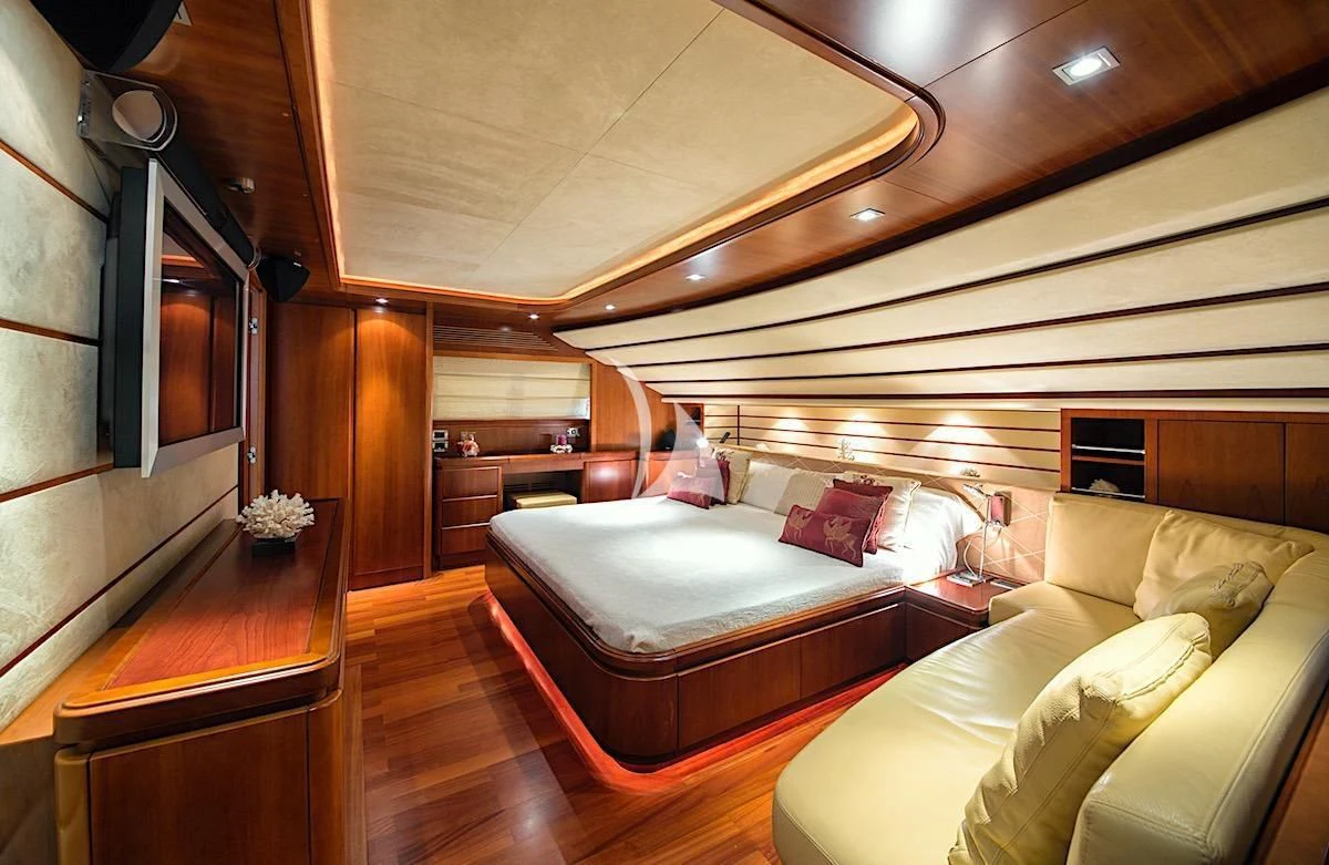 a room with a bed and a piano aboard ANNE MARIE Yacht for Sale