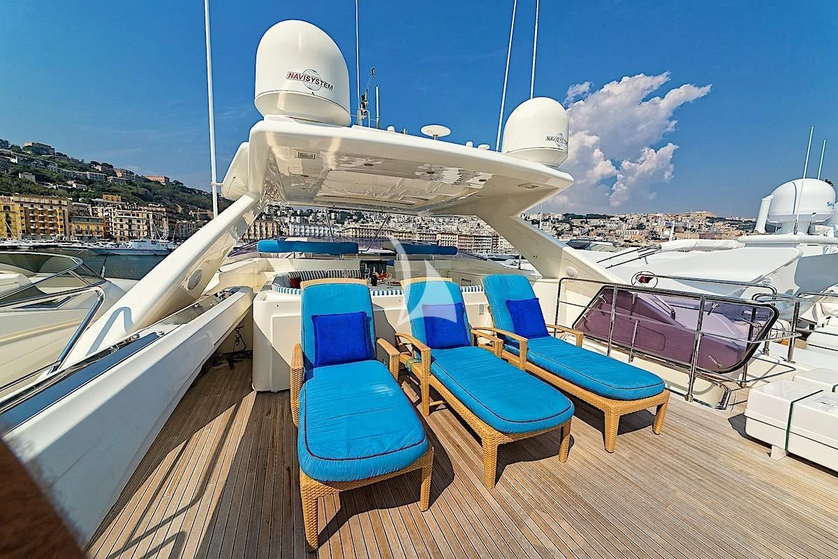 a deck with chairs and tables on it aboard ANNE MARIE Yacht for Sale