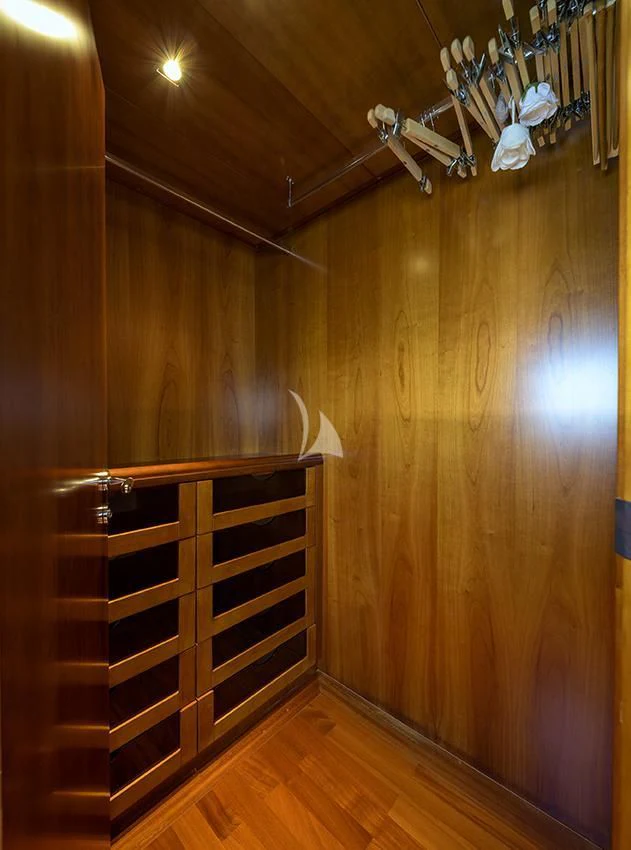a wooden cabinet with drawers aboard ANNE MARIE Yacht for Sale