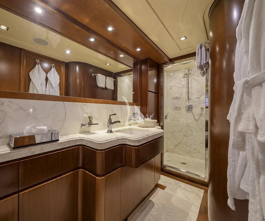 a bathroom with a large mirror aboard ANNE MARIE Yacht for Sale