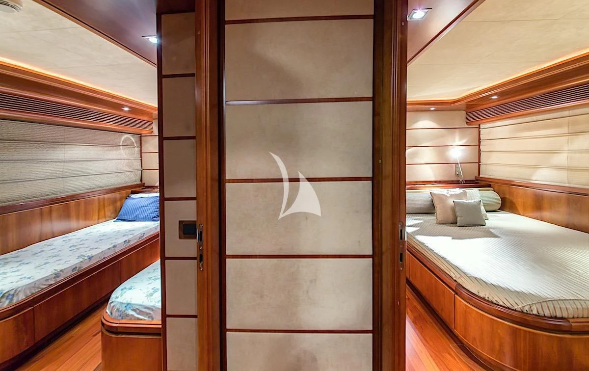 a room with a bed and a door aboard ANNE MARIE Yacht for Sale