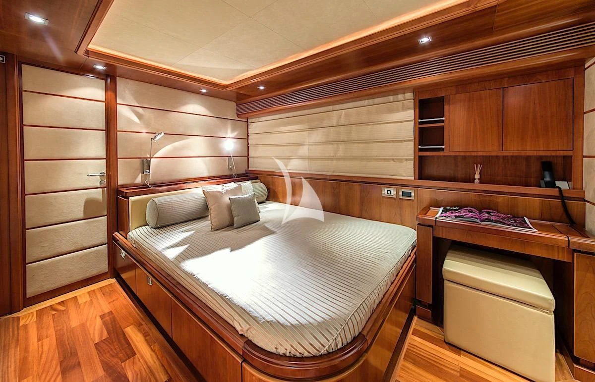 a room with a bed and a desk aboard ANNE MARIE Yacht for Sale