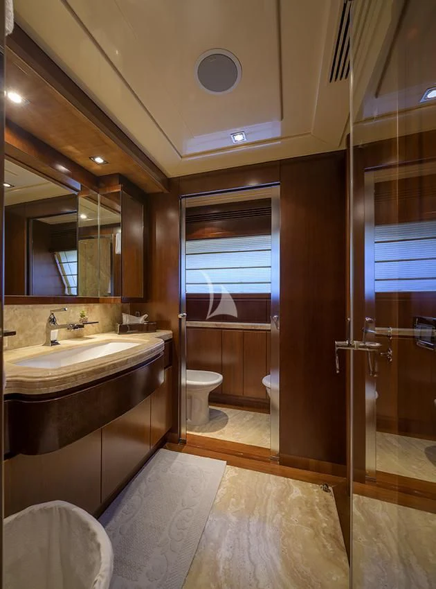 a bathroom with a sink and a mirror aboard ANNE MARIE Yacht for Sale