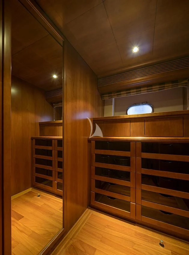 a wooden room with a wood cabinet aboard ANNE MARIE Yacht for Sale