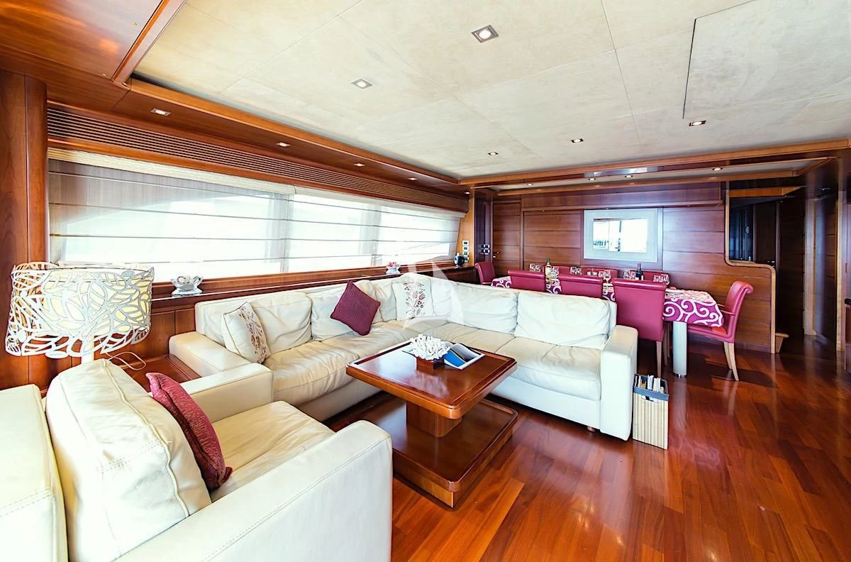 a living room with a couch and a table aboard ANNE MARIE Yacht for Sale