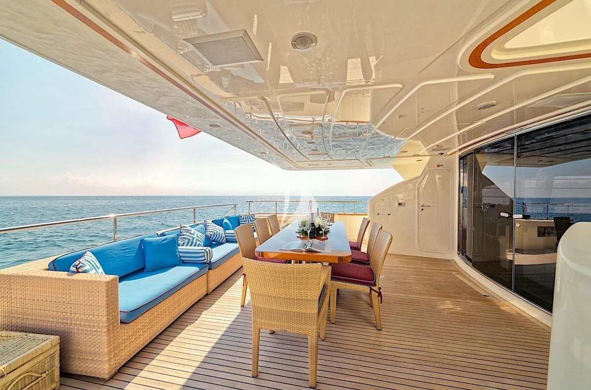 a boat with a table and chairs aboard ANNE MARIE Yacht for Sale