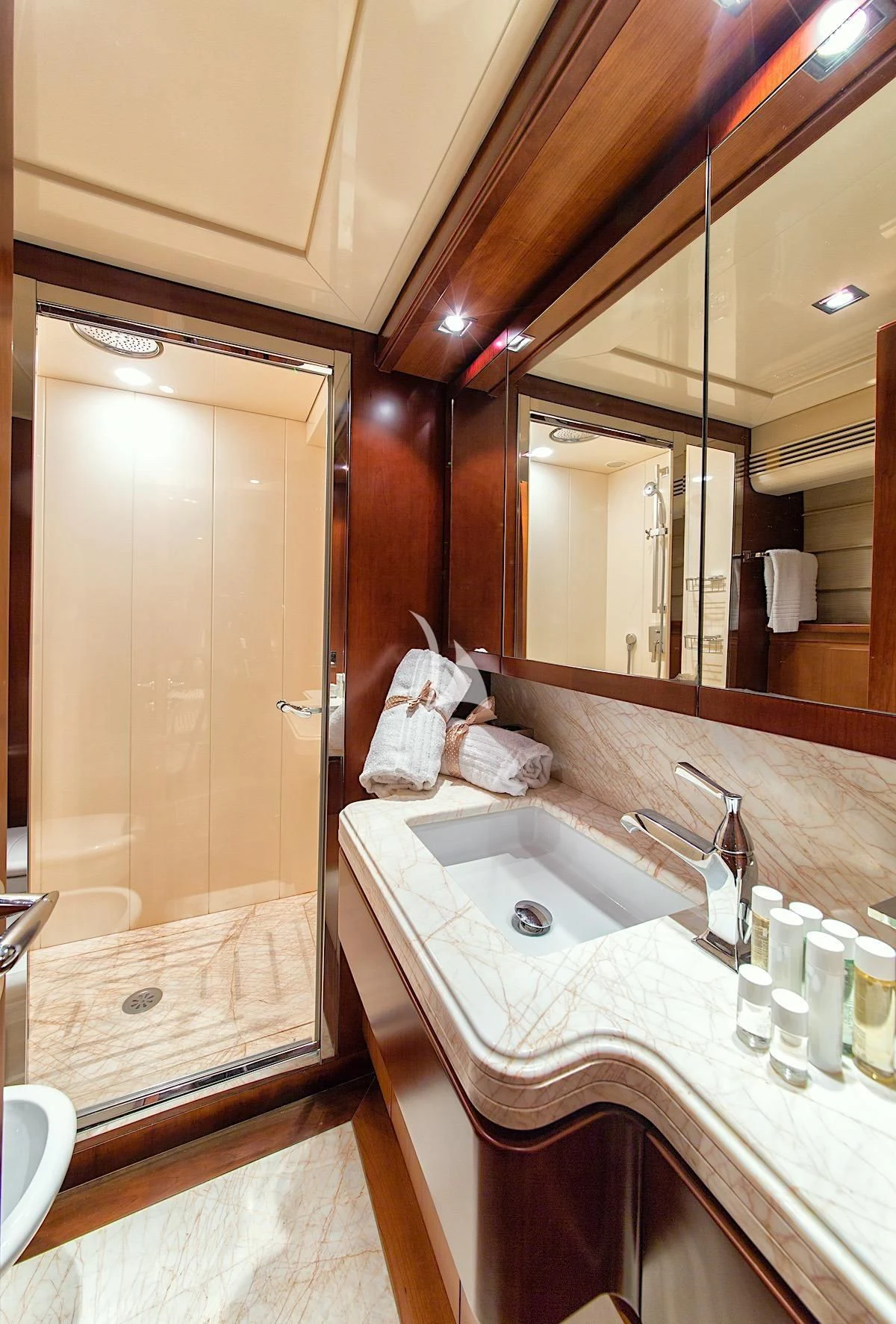 a bathroom with a large mirror aboard ANNE MARIE Yacht for Sale