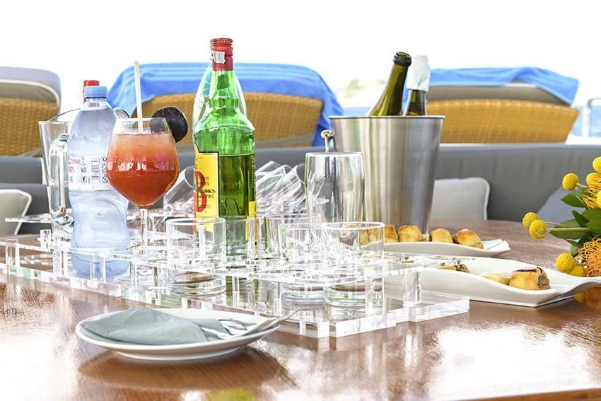 a table with food and drinks on it aboard ANNE MARIE Yacht for Sale