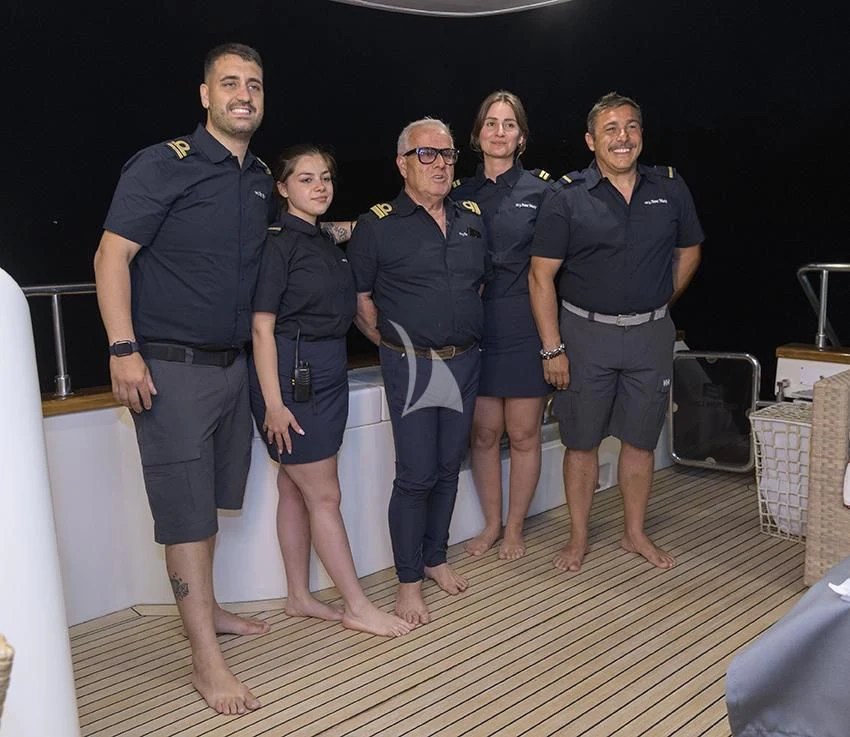 a group of people posing for a photo aboard ANNE MARIE Yacht for Sale