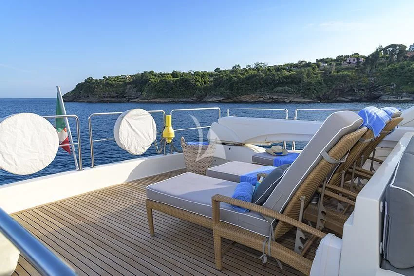 a deck with chairs and umbrellas on it aboard ANNE MARIE Yacht for Sale