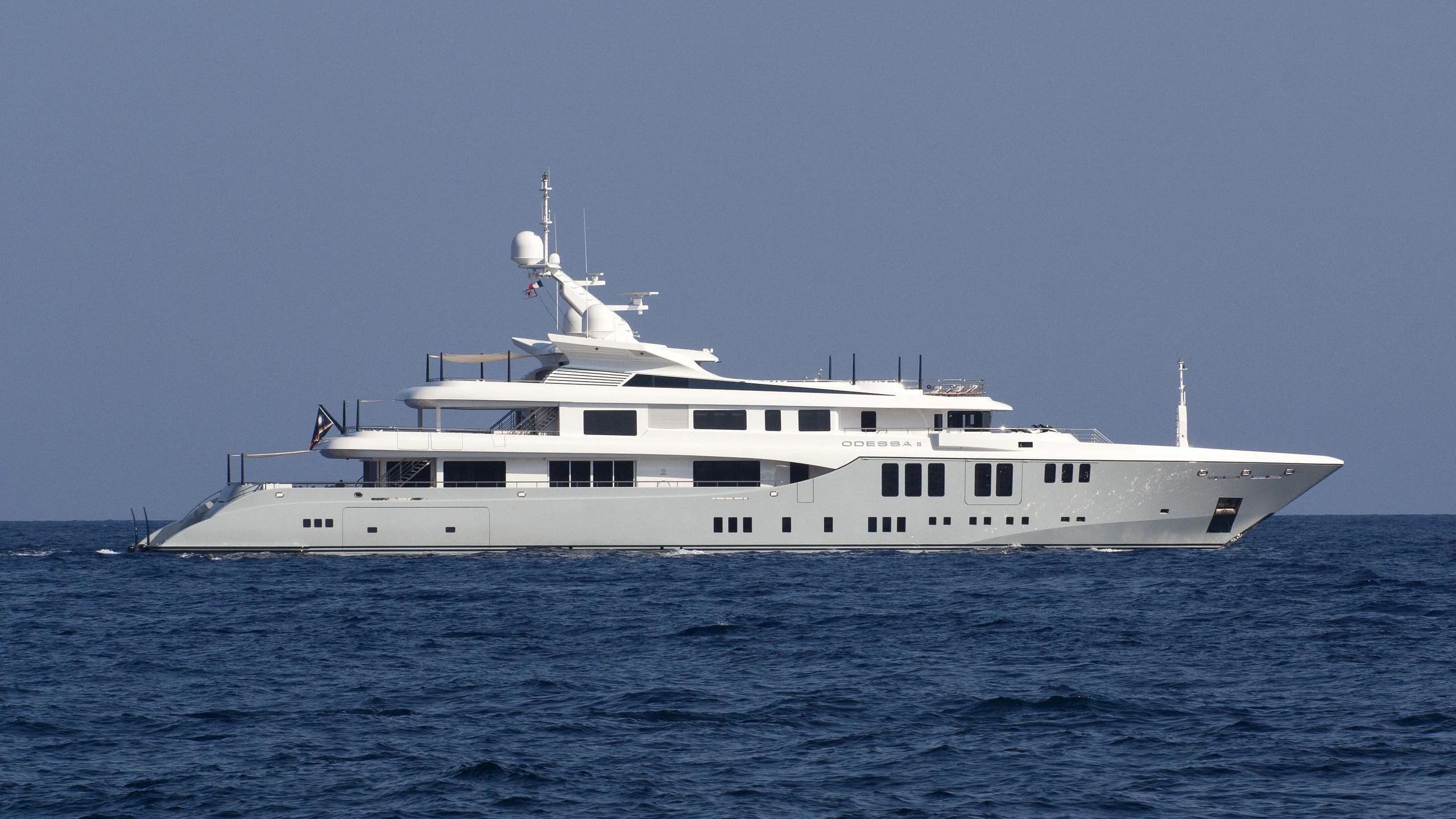 a large white boat in the water aboard ODESSA II Yacht for Sale
