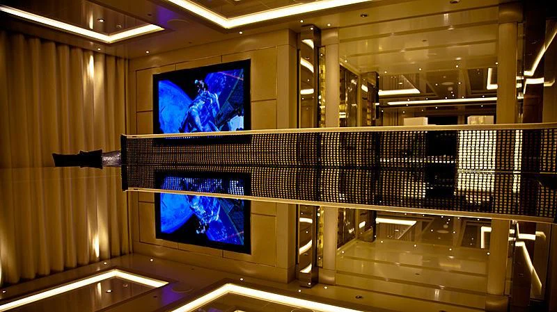 a large room with a tv aboard ODESSA II Yacht for Sale