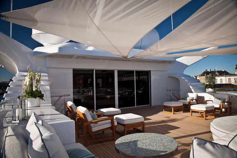 a room with a large patio and a pool aboard ODESSA II Yacht for Sale