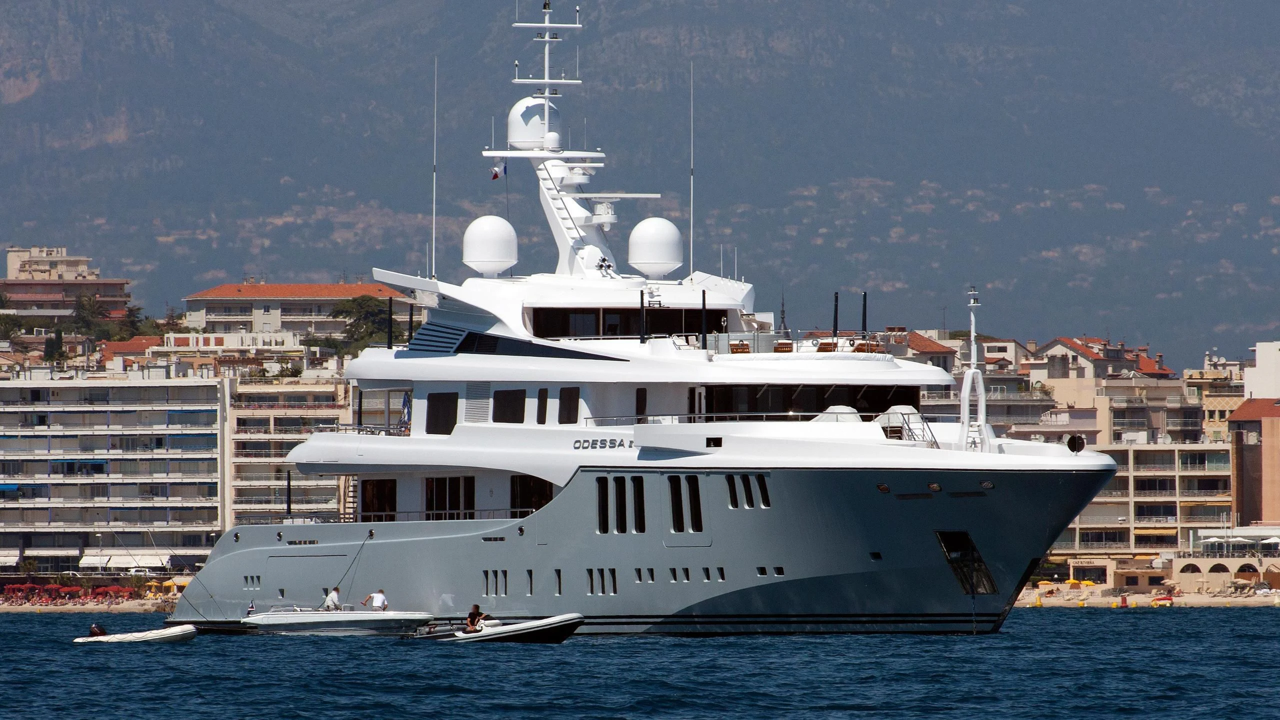 a large white boat in the water aboard ODESSA II Yacht for Sale