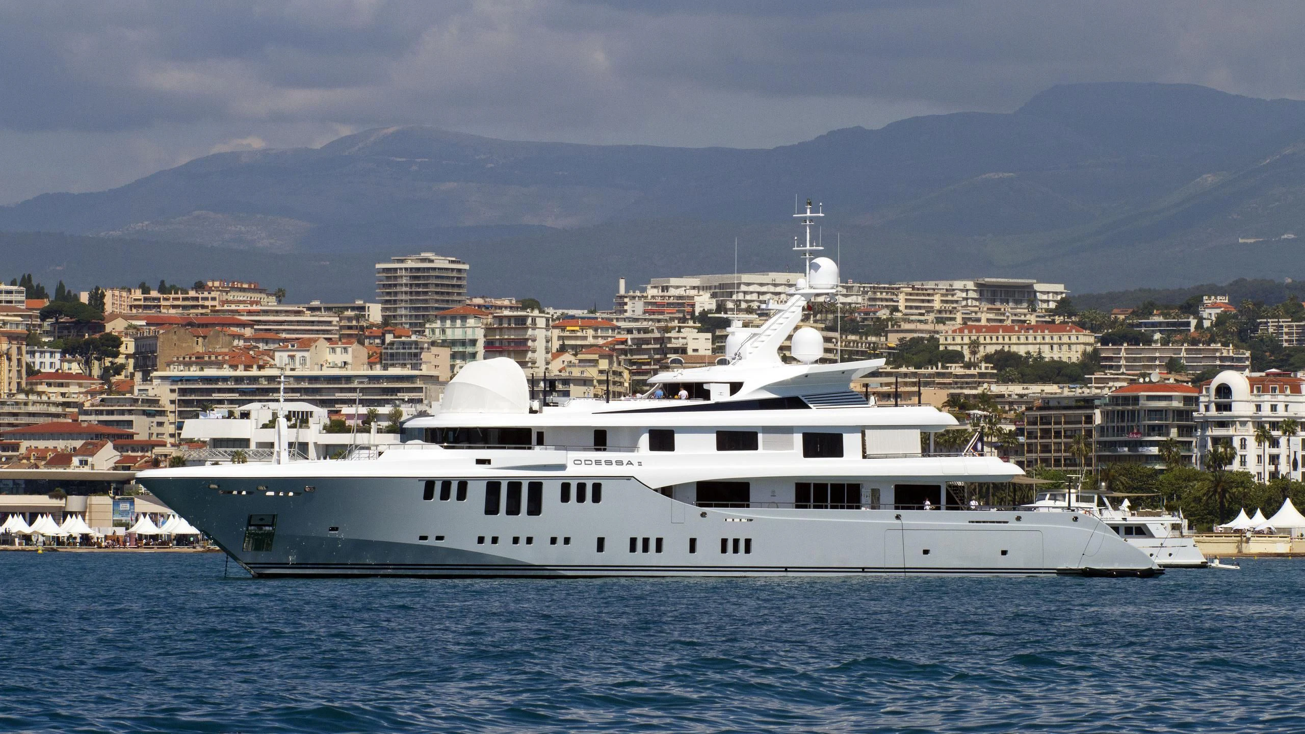 a large white yacht in the water aboard ODESSA II Yacht for Sale
