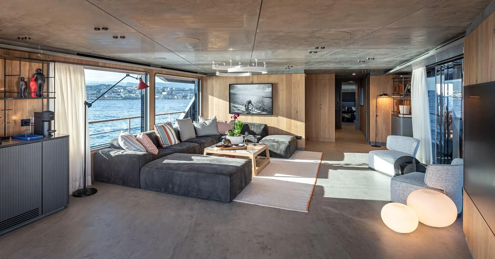 a living room with a couch and a coffee table aboard TUCCINI Yacht for Sale