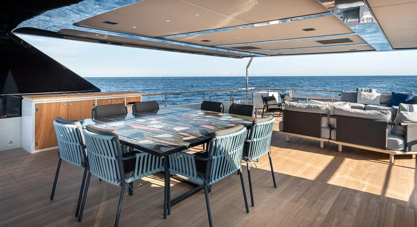 a room with a table and chairs aboard TUCCINI Yacht for Sale