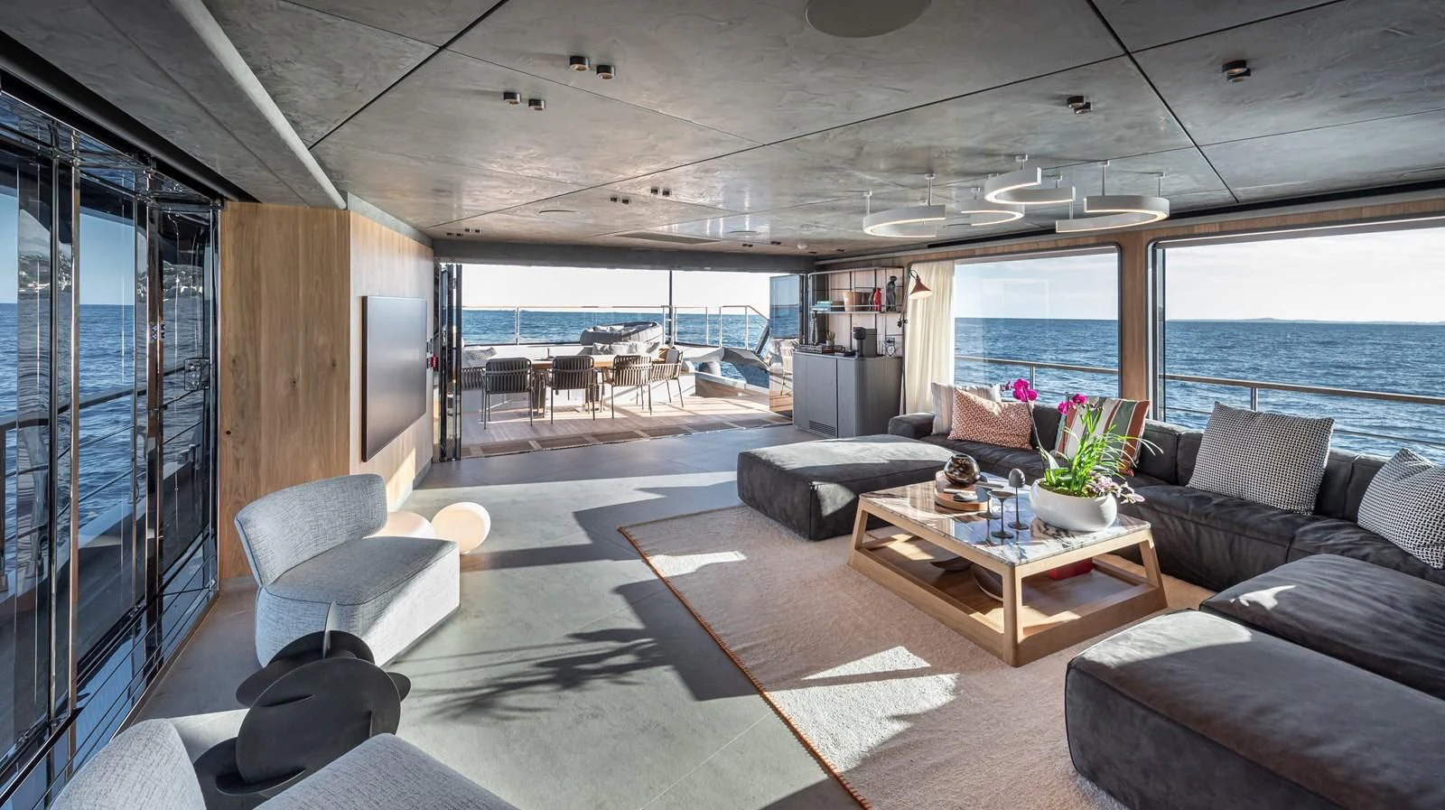 a living room with a large window aboard TUCCINI Yacht for Sale