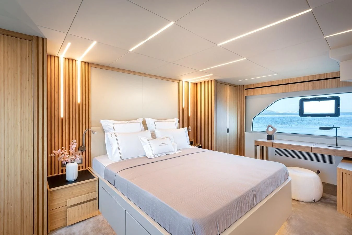 a room with a bed and a window aboard TUCCINI Yacht for Sale