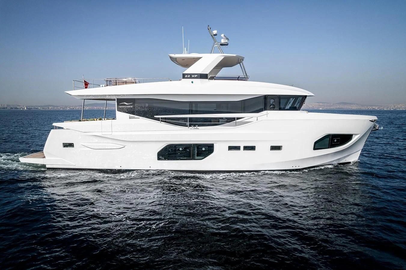 a white yacht in the water aboard TUCCINI Yacht for Sale