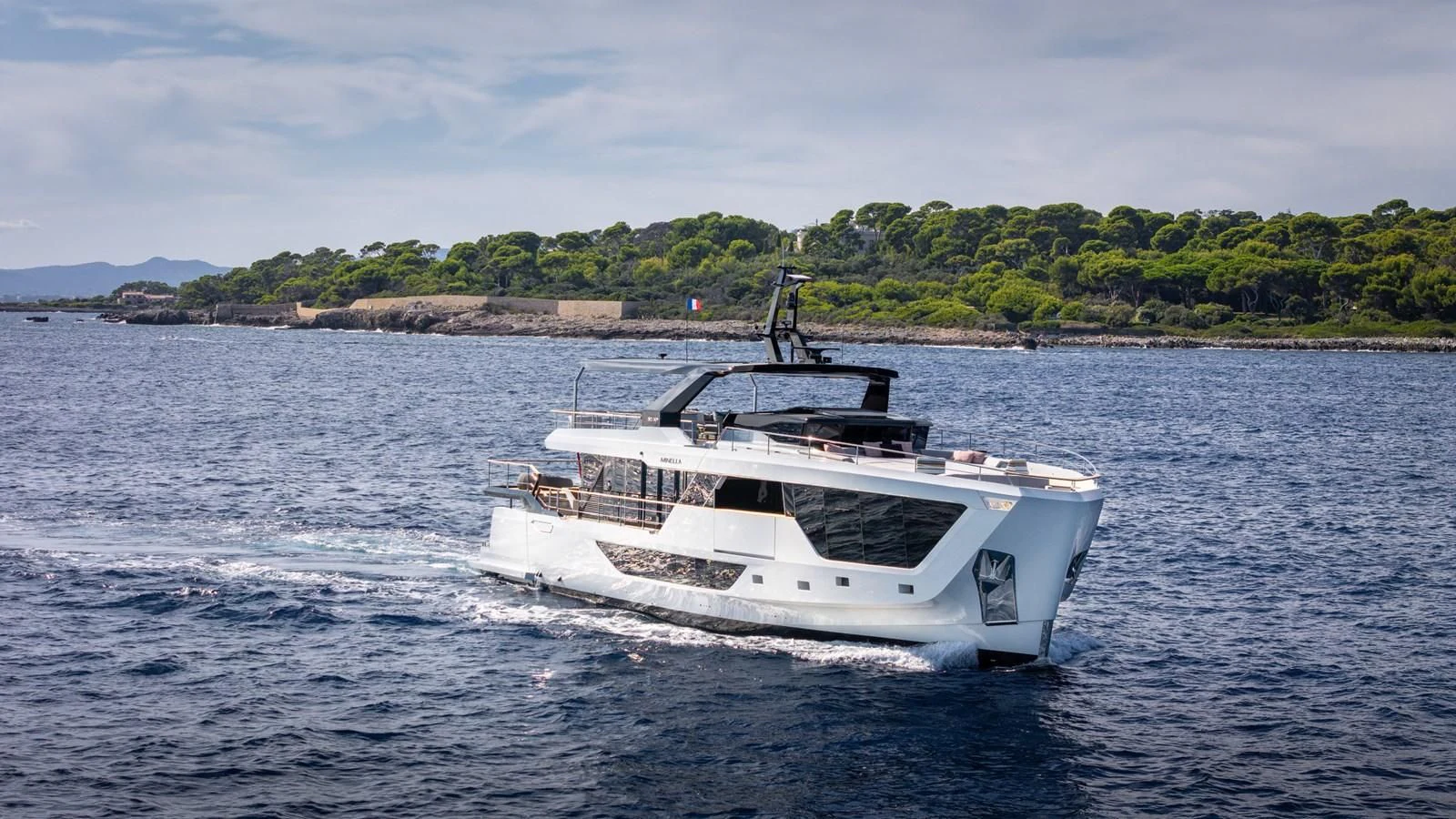 a white boat on the water aboard TUCCINI Yacht for Sale