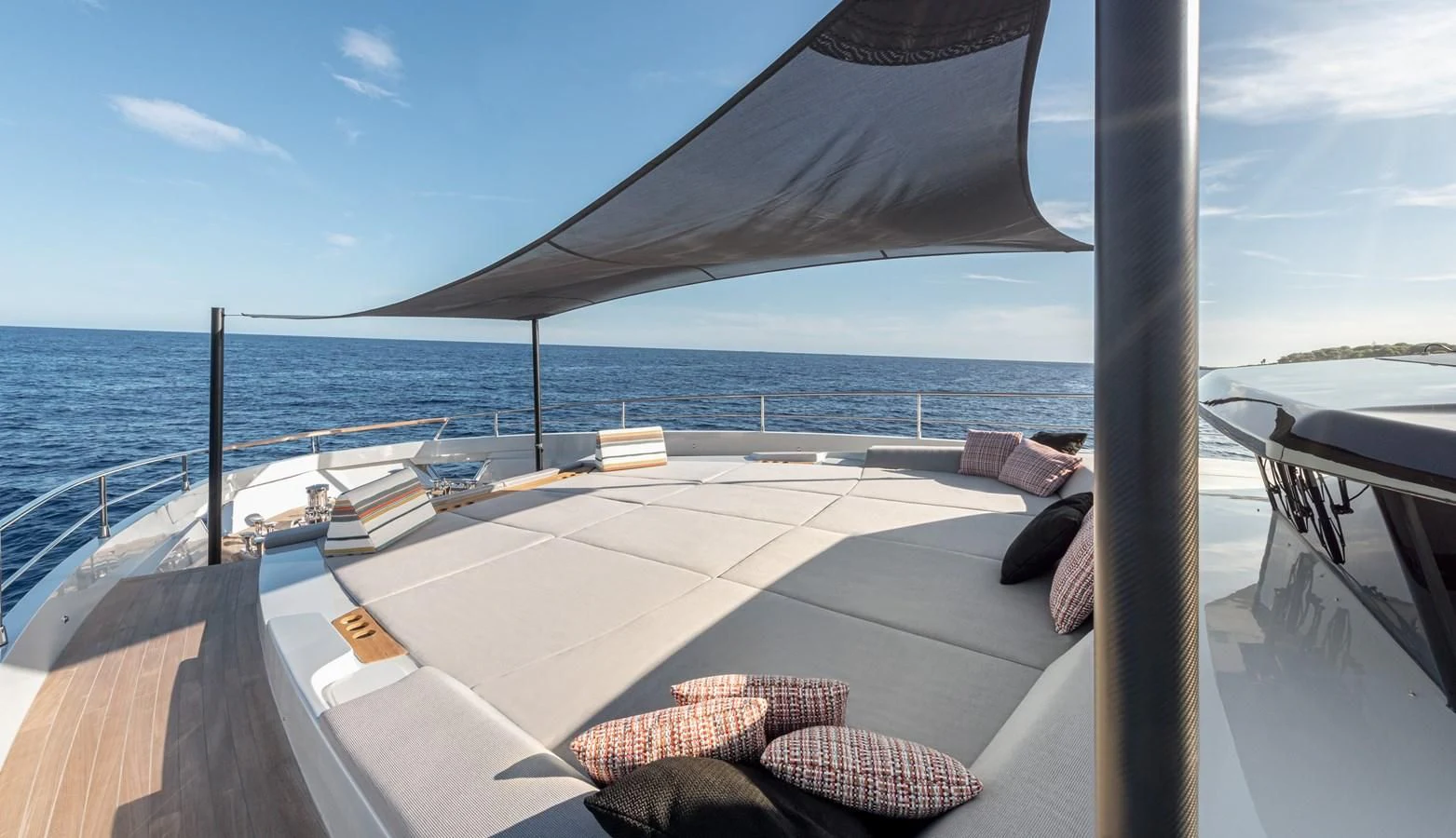 a deck with a large body of water in the background aboard TUCCINI Yacht for Sale
