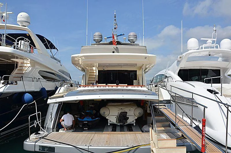 a boat docked at a pier aboard APMONIA Yacht for Sale