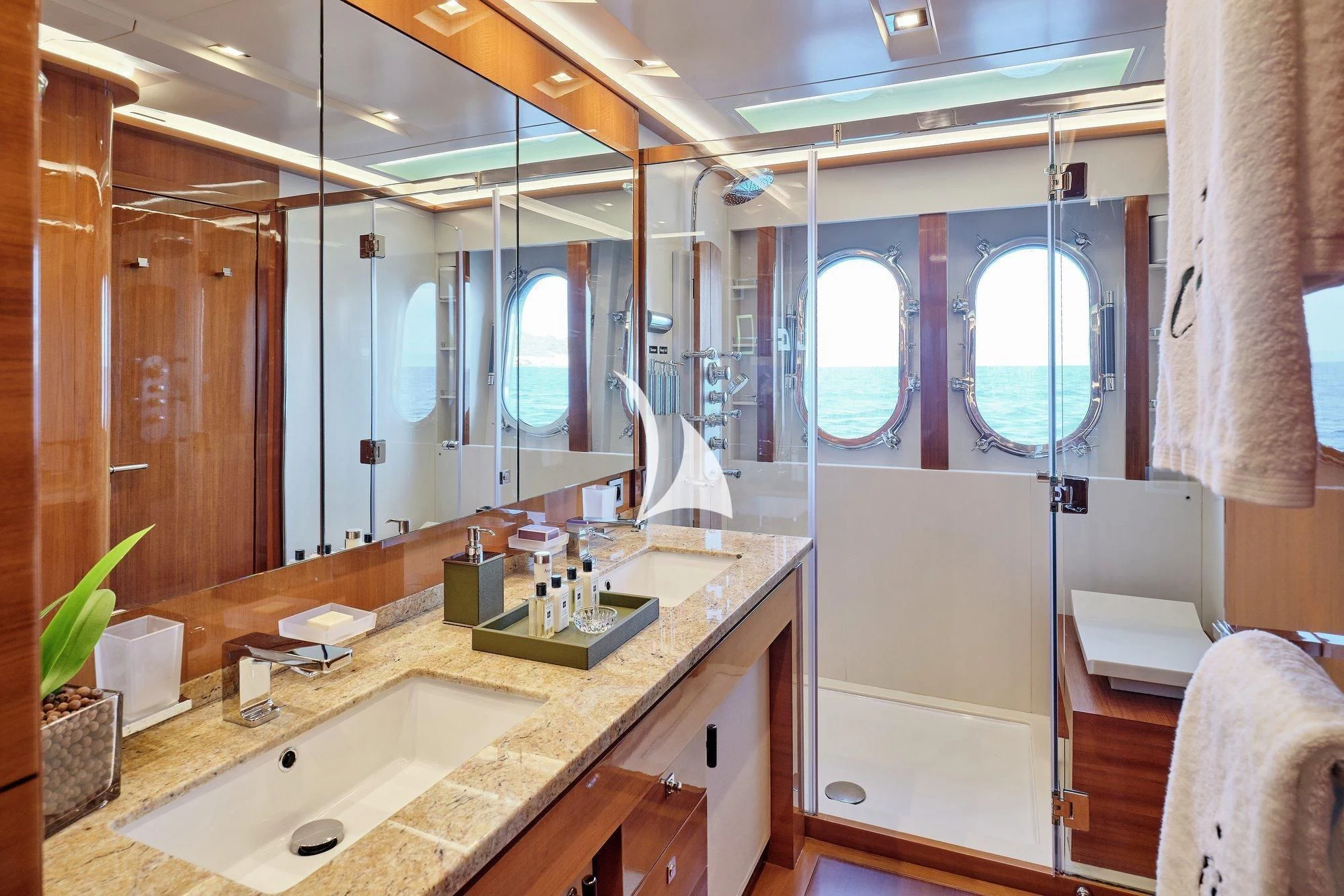 a bathroom with a large mirror aboard APMONIA Yacht for Sale