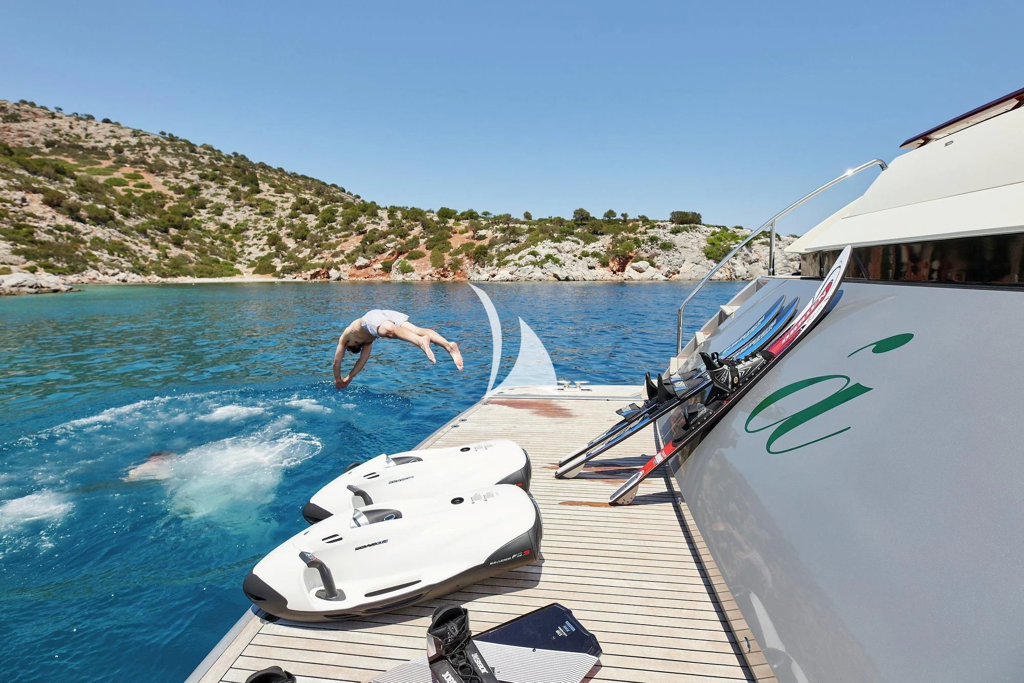 a dolphin jumping out of a boat aboard APMONIA Yacht for Sale