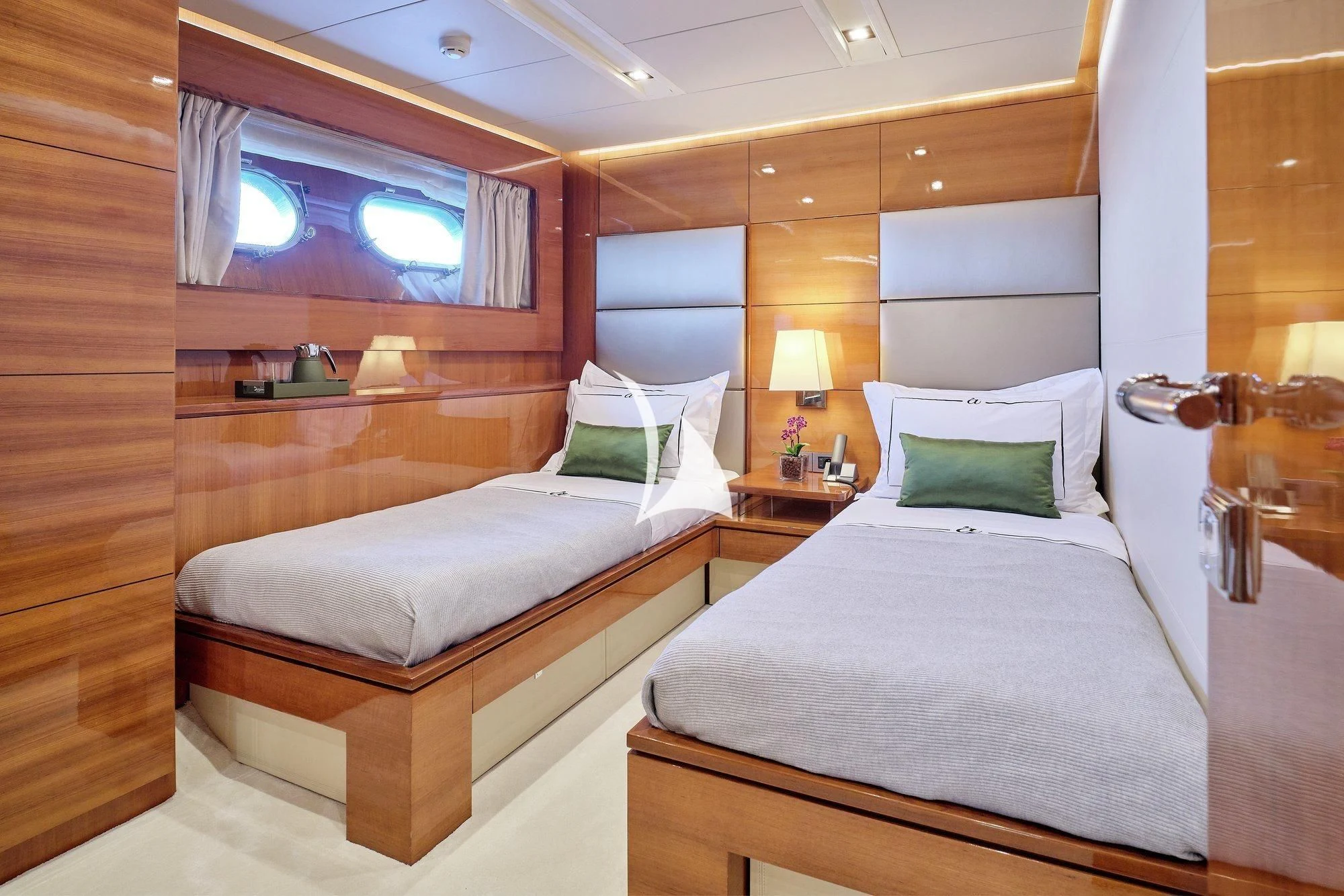 a room with two beds aboard APMONIA Yacht for Sale