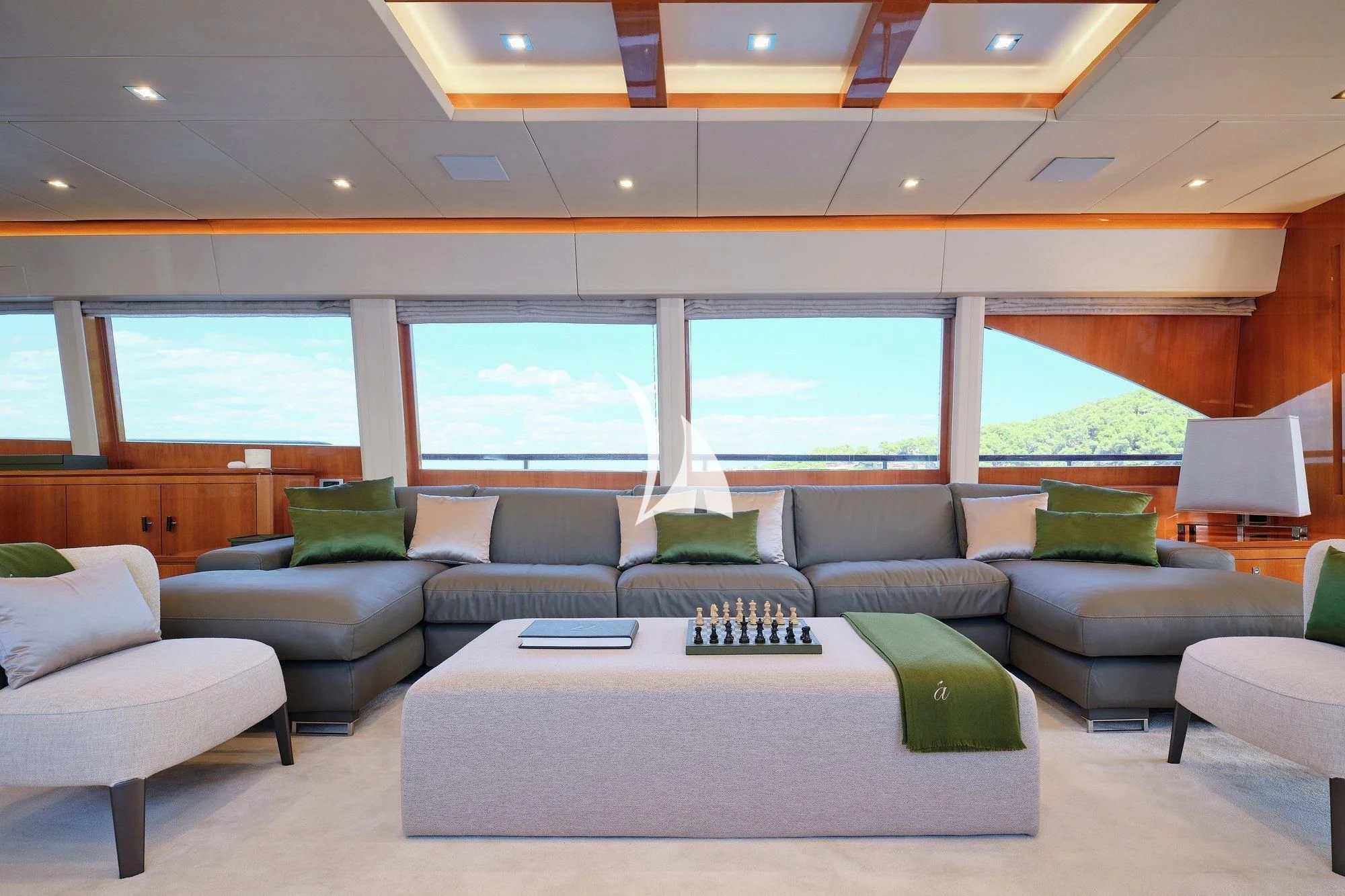a large living room with a large window aboard APMONIA Yacht for Sale