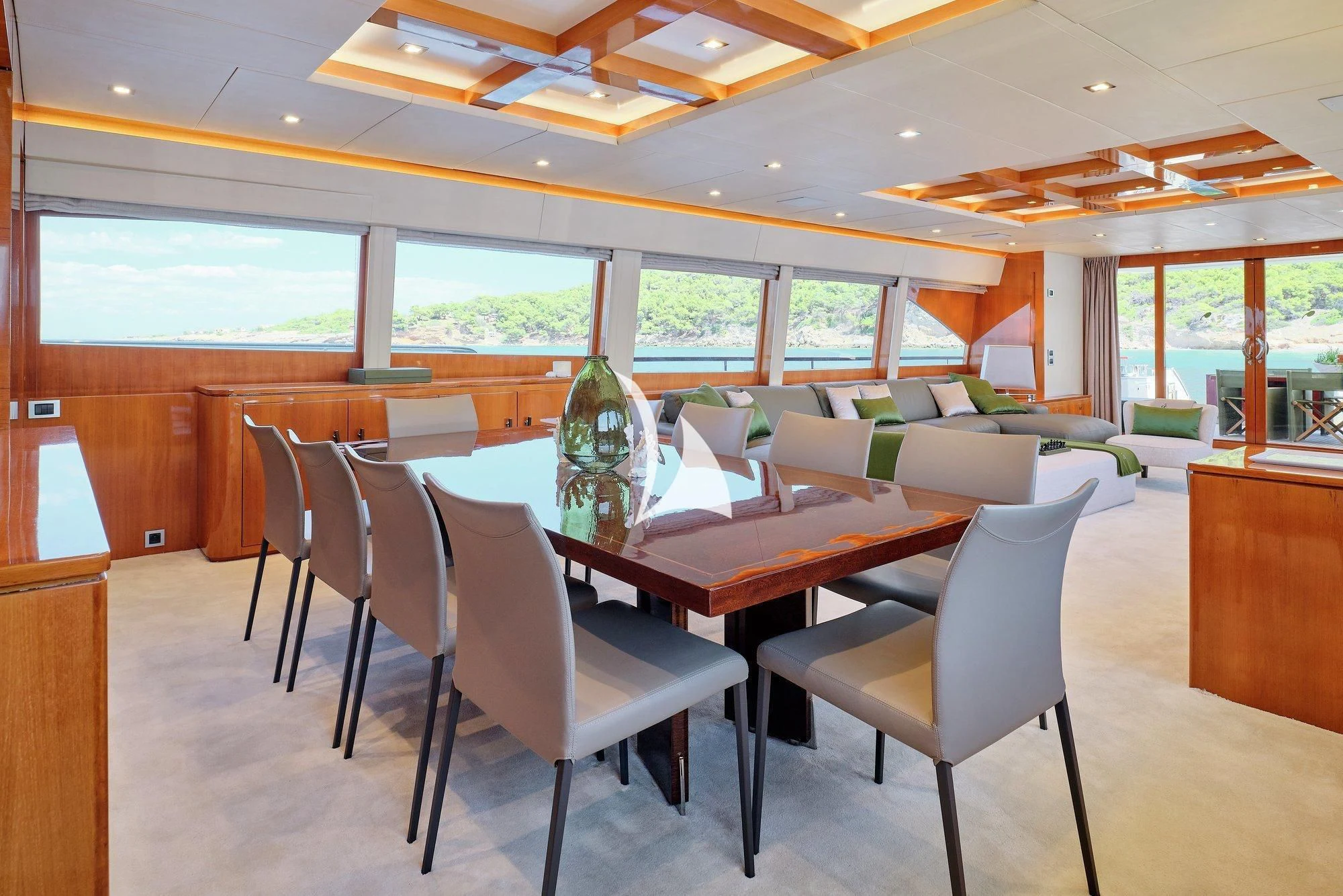 a room with a table and chairs aboard APMONIA Yacht for Sale