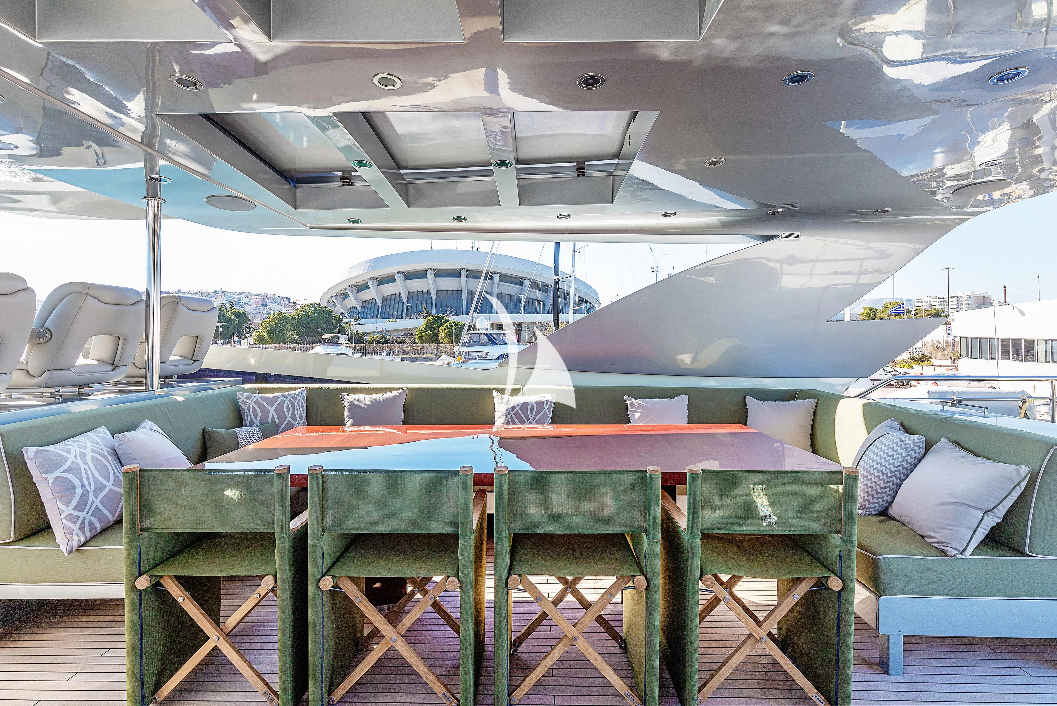 a pool with chairs and tables aboard APMONIA Yacht for Sale