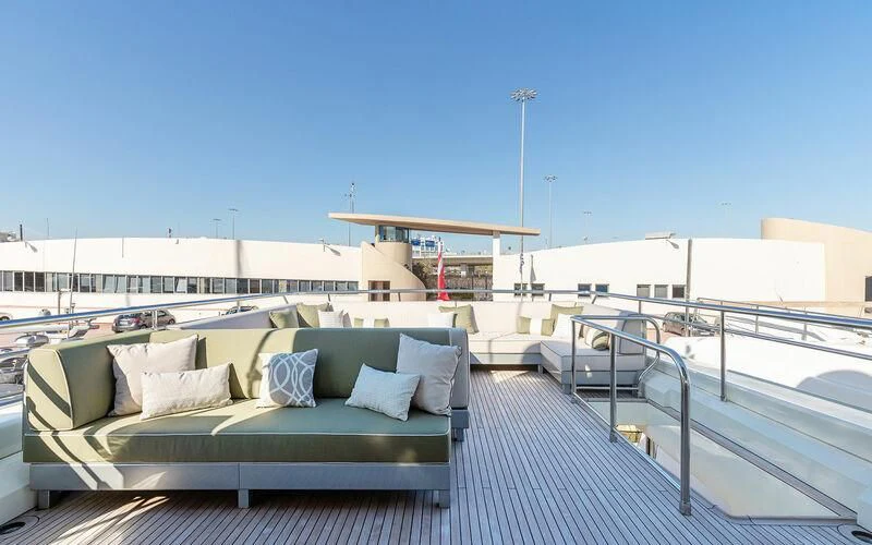 a couch on a deck aboard APMONIA Yacht for Sale