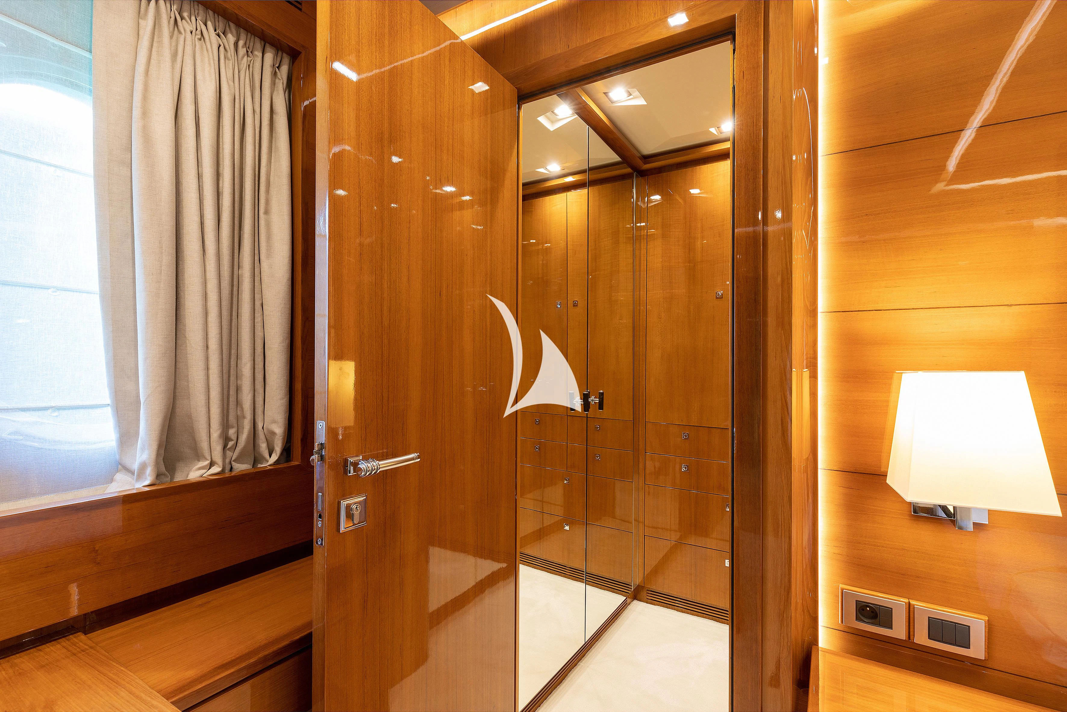 a bathroom with a glass shower aboard APMONIA Yacht for Sale