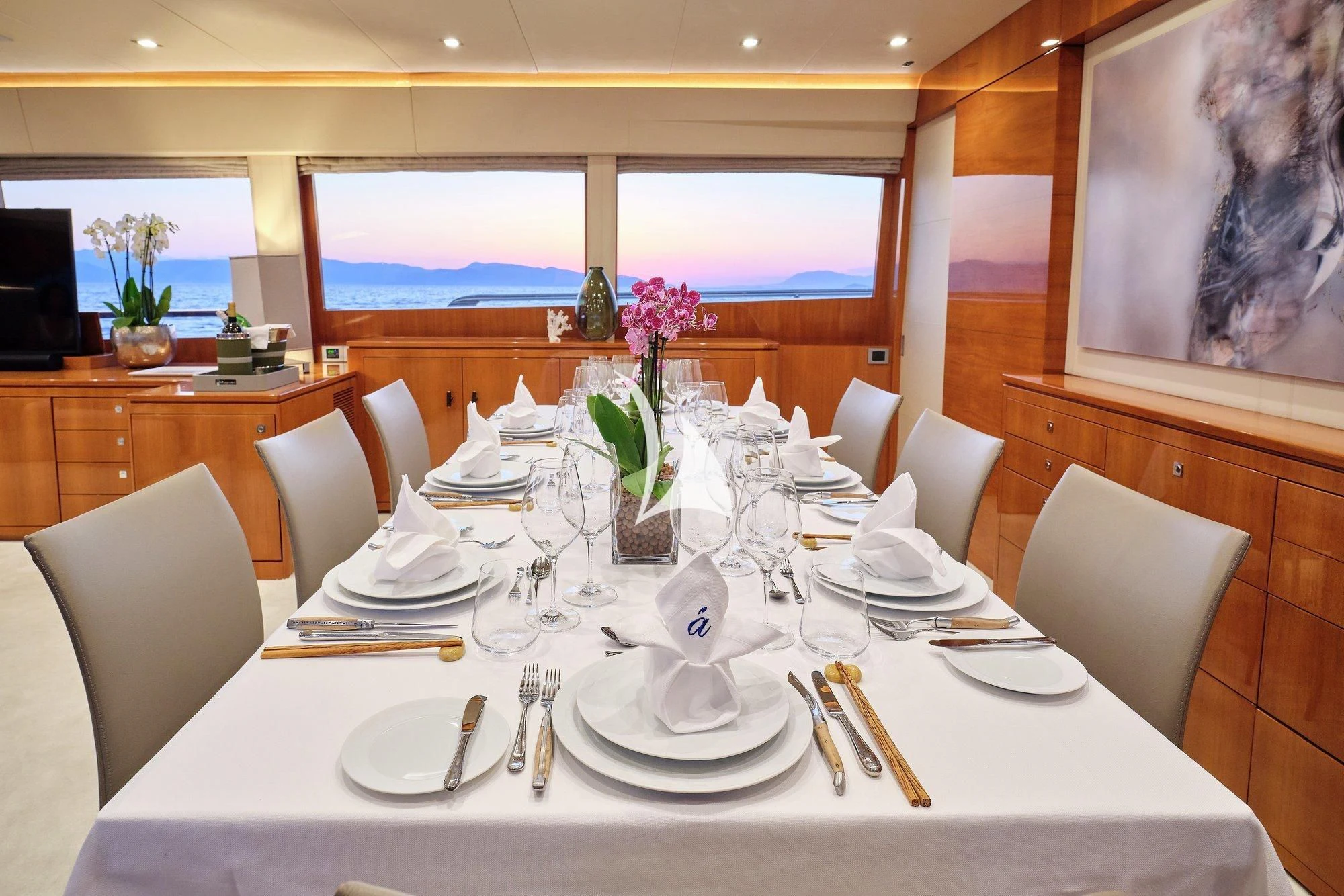 a table set for a dinner aboard APMONIA Yacht for Sale